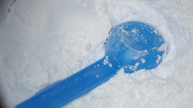Close up of a scoop in a creatine powder