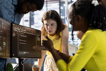 IT staff members doing brainstorming, conducting tests in computer to optimize machine learning...