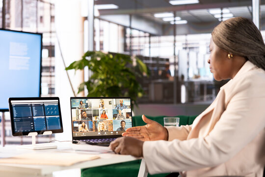 Manager in office talking in videocall, maintaining strong relationships with key clients, suppliers and business partners. Woman in teleconference meeting coordinating administrative operations