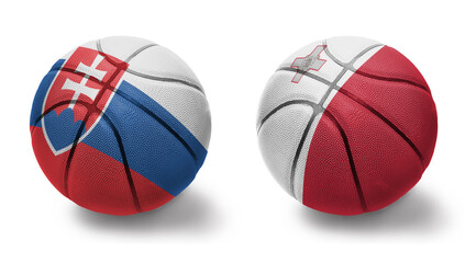 Fototapeta premium basketball balls with the national flags of malta and slovakia on the white background.