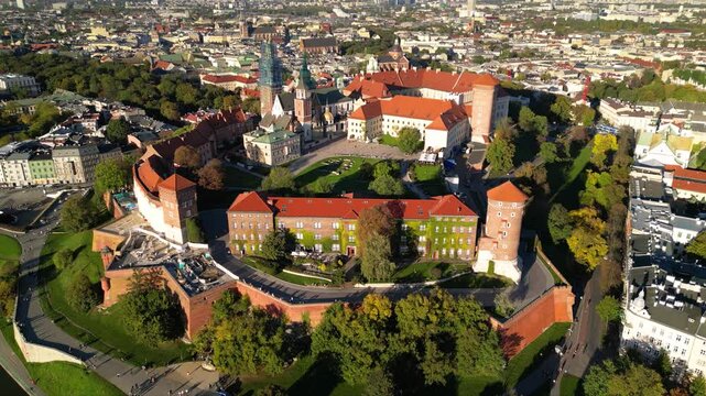 High angle shot of Wawel Royal Castle in Krakow, Poland. Footage oof Zamek Kr&oacute;lewski na Wawelu in Cracow seen from the air. Classical Crowning place of all Polish kings. Cityscape during sunrise.
