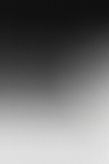 Abstract blurry grainy black and white gradient background. Dark grain and noise vertical template for textures, backdrops and wallpapers and overlays with copyspace