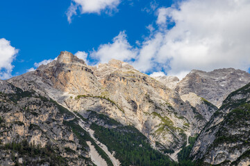 Fototapeta premium Dolomite mountains scenic landscape of towering rocky peaks in the Alps. High walls in the Alps from climbing and trekking path. Alpine route in the Dolomiti Alps surrounded by rock towers in Italy