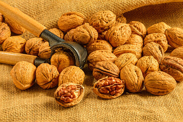 Rustic walnuts on burlap fabric.