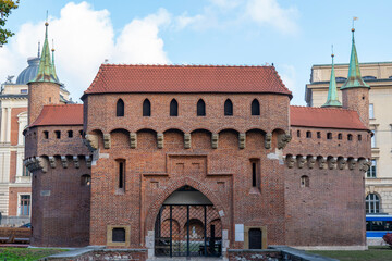 Fototapeta premium Krakow Old Town St. Mary's Basilica Main Market Square St Florians gate and Barbakan Royal Castle St. Joseph's Church