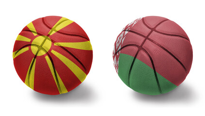 basketball balls with the national flags of belarus and macedonia on the white background.