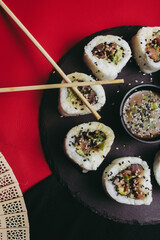 Elegant sushi and Japanese dishes featuring fresh ingredients, including nigiri, sashimi, and rolls, highlighting the artistry and tradition of Japanese cuisine.
