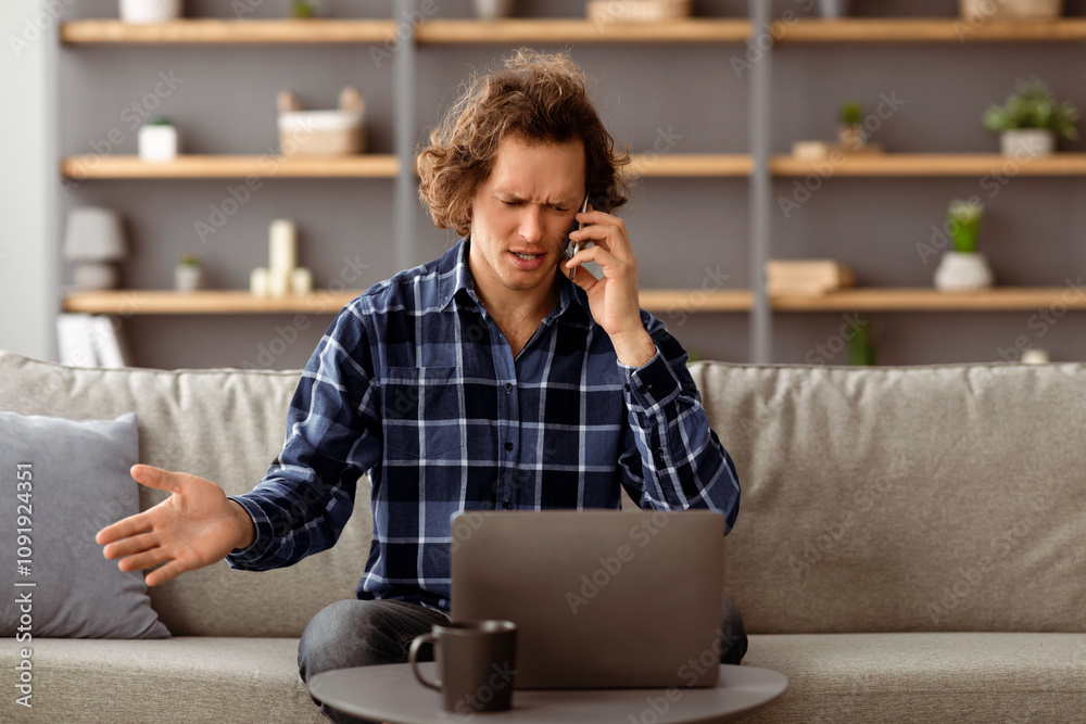 Poster Discontented Man Talking On Phone Using Laptop Having Problem With Computer Or Internet Connection Sitting At Home. Displeased Customer Calling To Hotline Service. Selective Focus