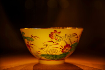 Famille rose mandarin duck lying on lotus covered bowl in Summer Palace Museum.
