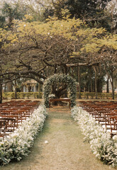 wedding ceremony under a cotton tree.