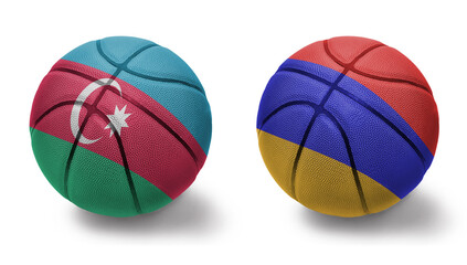 basketball balls with the national flags of armenia and azerbaijan on the white background.