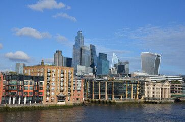 Fototapeta premium London, England, United Kingdom - October 2024: Panoramic view of Bank, London's leading financial district with blue sky and clouds autumn or fall
