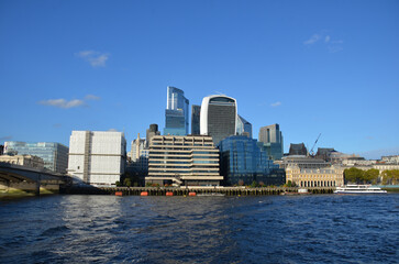 Naklejka premium London, England, United Kingdom - October 2024: Panoramic view of Bank, London's leading financial district with blue sky and clouds autumn or fall