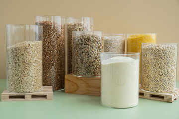 Set of Raw porridges in sustainable packaging. Refillable systems of packaging. Gluten free cereals. Health gut benefits. Concept of alternative whole spelt grain ingredient. Vegetarian diet recipes