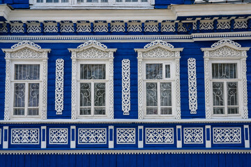 Fototapeta premium Fragment of a 19th century wooden house with carved platbands in Gorodets, Russia