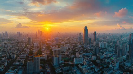 Fototapeta premium Stunning panoramic sunset view over a sprawling cityscape.