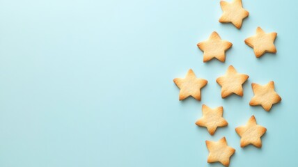 Fototapeta premium Star-shaped cookies on light blue background