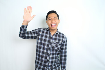Fototapeta premium excited asian man waving hand welcoming say hello and hi gesture isolated on white background wear casual shirt