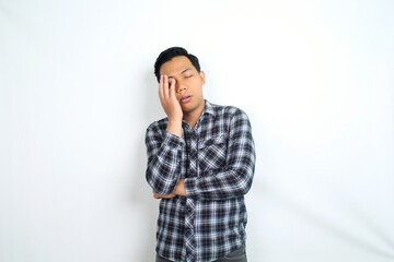 unhealthy asian man feel migraine and fatigue isolated on white wearing casual shirt