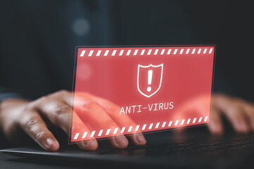 Firewall hacker protection safety and concept of antivirus alert. Businessman or personnel, programmer, or developer is using a computer laptop with an exclamation mark and a shield red sign.
