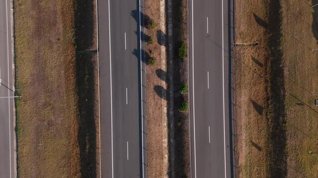 Aerial footage of a truck driving on the A2 motorway on a clear sunny day in Portugal