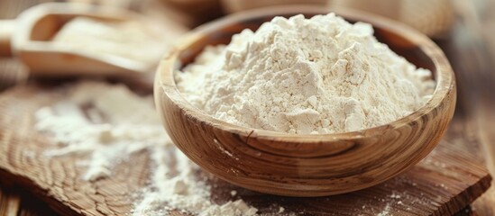 Fototapeta premium Close-up of Flour in Wooden Bowl