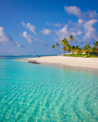 paradise island surrounded by turquoise lagoon and blue skies in the maldives