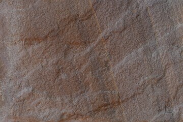 Aged brown sandstone background with vintage grunge pattern.