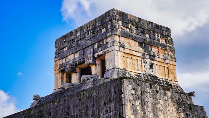 Jaguars frieze with Mayan motifs and relief decorations on top of the Temple of Jaguars near the Great Ball Court or Juego de Pelota in the Great Mayan temple complex of Chichen Itza,Yucatan,Mexico 