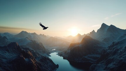 A silhouette of an eagle flying over snow-capped mountains at sunrise.