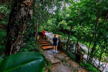 Natural background of ancient sculptures of religious tourist attractions, Naga statues, old churches by the natural waterfall from the high mountain, Wat Phalat, the way up to Doi Suthep, Chiang Mai