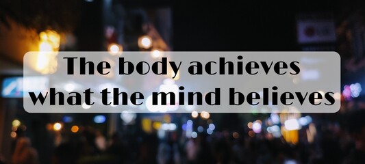 The body achieves what the mind believes.Inspiring and motivational about life and success. Abstract blurry photo of city light at night as background

