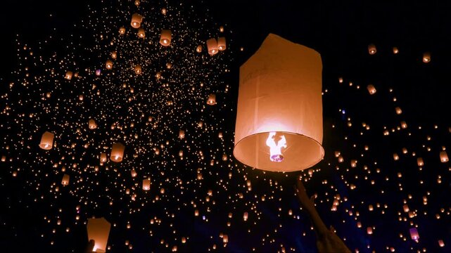 Releasing lanterns at the Yi Peng Festival in Chiang Mai.