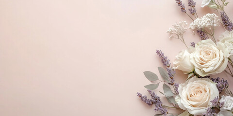 Elegant floral arrangement with roses and lavender on soft pink background