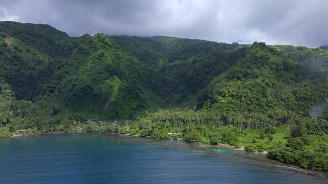 Remote Tautira Bay North Shore Tahiti island French Polynesia aerial drone Vallee de Teahupoo Taiarapu Papara Tavera Vaitepiha River village coastline South Pacific Ocean backwards motion