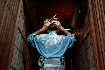 Japanese woman dressing traditional costume in the streets of Kyoto