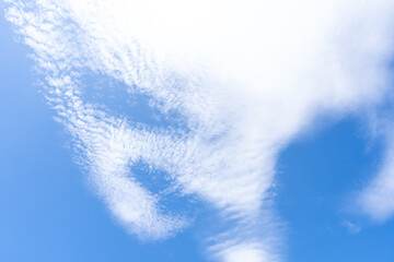 Low angle view and full frame of beautiful blue sky with strange shape of clouds in the morning or evening in sunny day used as natural background texture in decorative art work