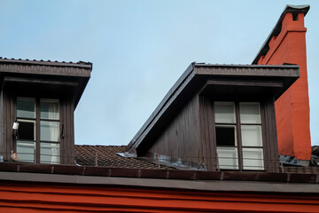 Dormer windows facing the roof of the house