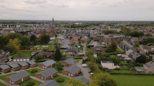 Church tower and cute township of Putte in Belgium, aeiral view