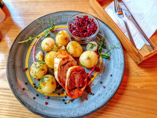 Roulade with dumplings and fried beetroots.