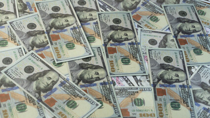 a large pile of hundred dollars USA money notes