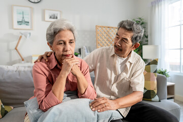Obraz premium Asian elderly husband comforting upset wife crying with tears for problem. 