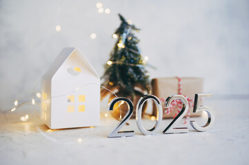 Naklejka premium New Year's lights gold and dark red colors bokeh background with glowing number 2025 and fireworks. Happy New Year concept for 2025.