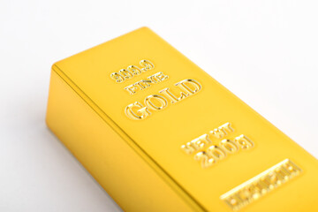 Gold bar isolated on white background. Investing in profitable assets
