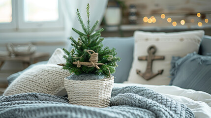 A cozy coastal nook featuring a small potted evergreen tree in a whitewashed wicker basket, decorated with nautical rope bows and tiny wooden anchor ornaments.