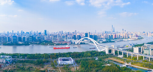 Fototapeta premium Aerial view of Shanghai skyline and HuangPu river at sunset.