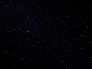 Fototapeta premium A dark canvas of midnight sky with twinkling stars scattered across it in a whimsical pattern, cosmic, luminous, radiant