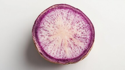 Freshly sliced taro root showcasing vibrant purple and cream swirls on a clean white background, emphasizing its unique texture and color.