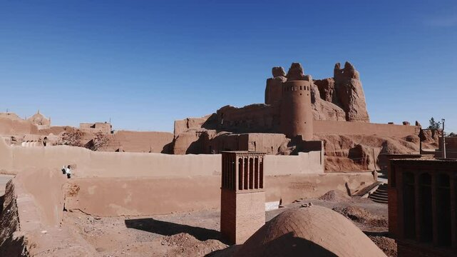 Ancient Iranian clay fort and village, with clay architecture in the desert. The use of Iranian Badger wind catchers to cool rooms. Ancient air conditioners or wind catchers a smart wind towers.