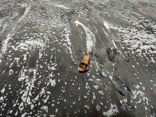 Obraz premium portrait on a beach in the afternoon with beautiful black sand